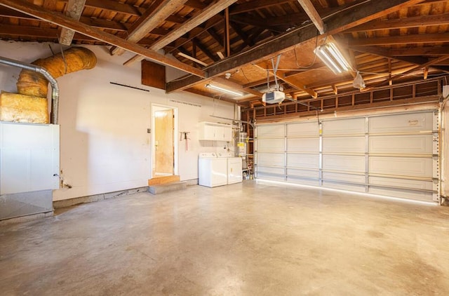 garage featuring separate washer and dryer, wood ceiling, and a garage door opener