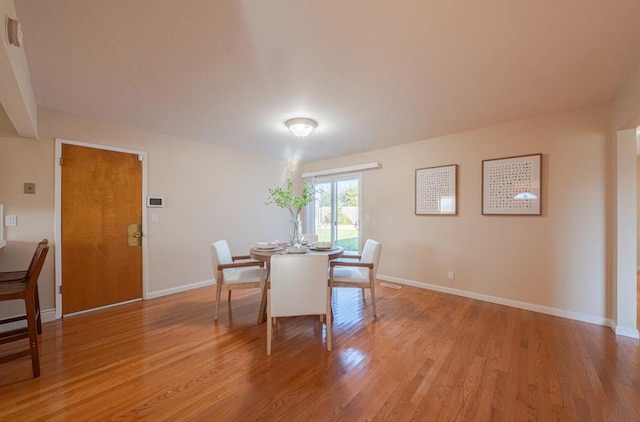 dining space featuring light hardwood / wood-style flooring