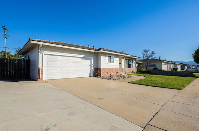 single story home with a garage and a front yard