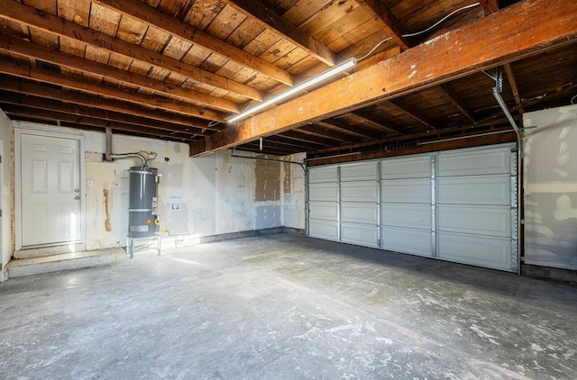 garage with strapped water heater and wooden ceiling