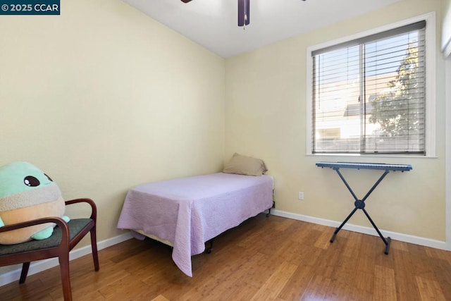 bedroom featuring ceiling fan and hardwood / wood-style flooring