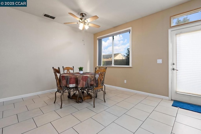 dining area featuring ceiling fan and light tile patterned floors