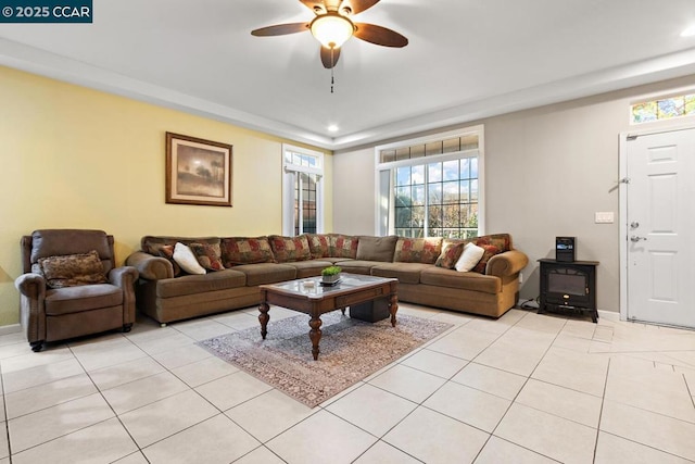 tiled living room featuring ceiling fan