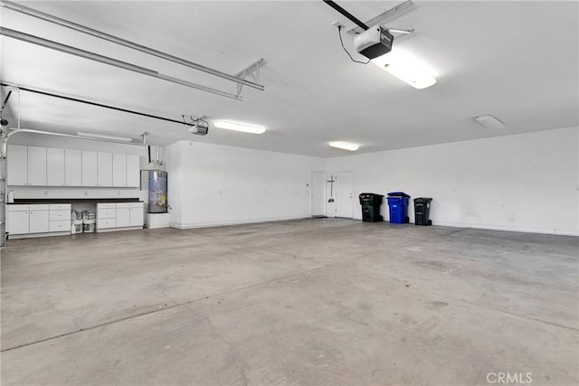 garage with water heater and a garage door opener