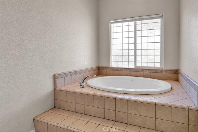 bathroom featuring a relaxing tiled tub