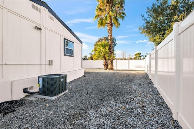 view of yard featuring central air condition unit