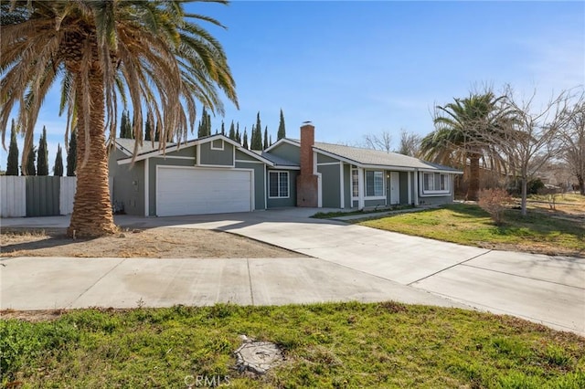 ranch-style house featuring a front lawn and a garage