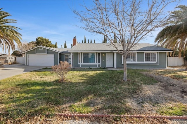 ranch-style home featuring a garage and a front yard