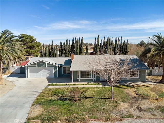 single story home featuring a front yard and a garage