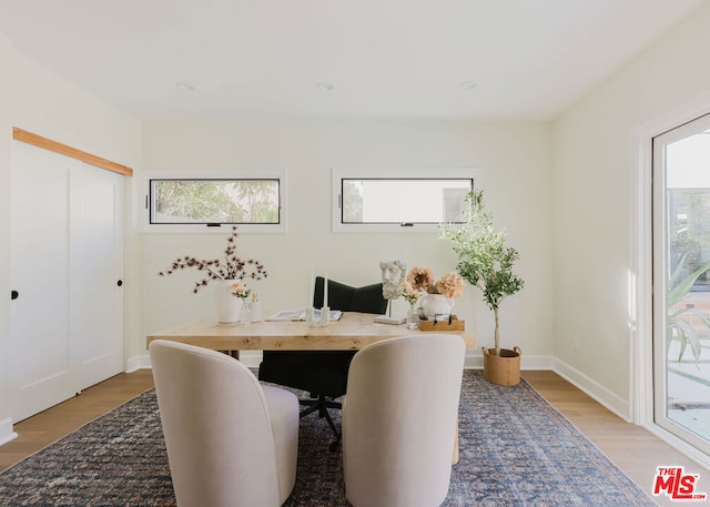 office area with light hardwood / wood-style flooring