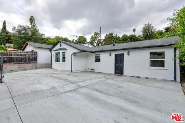 back of property featuring a patio area