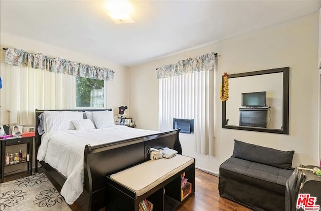 bedroom with hardwood / wood-style flooring