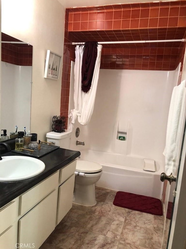 full bathroom featuring toilet, vanity, and shower / bath combination with curtain