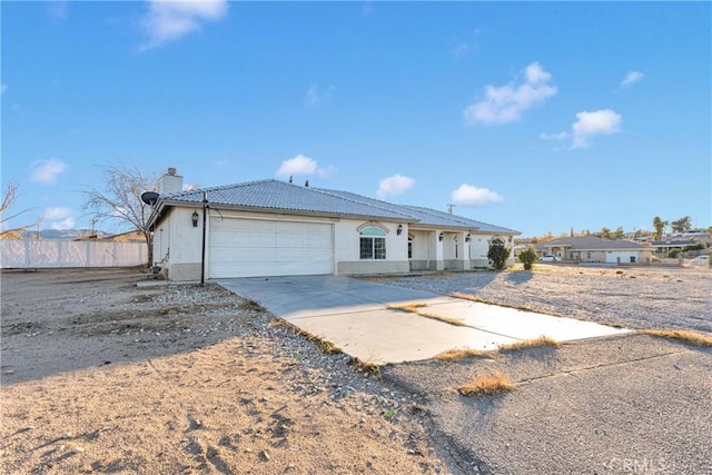 ranch-style home featuring a garage