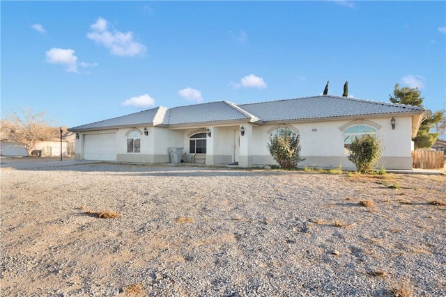 ranch-style home featuring a garage