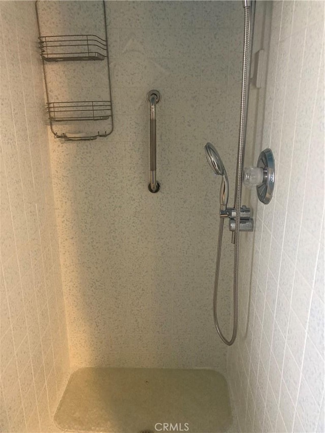 details with a tile shower