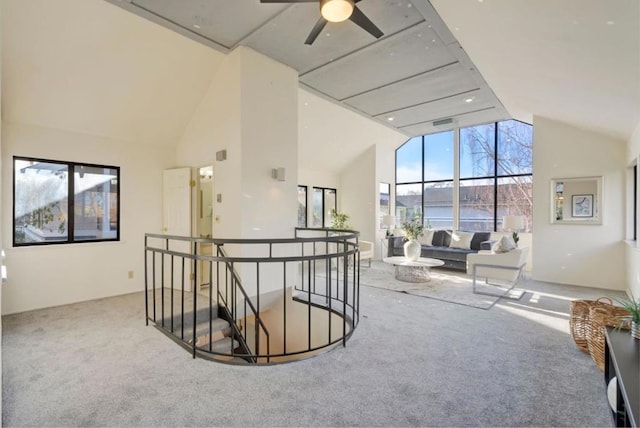 hallway featuring lofted ceiling and carpet