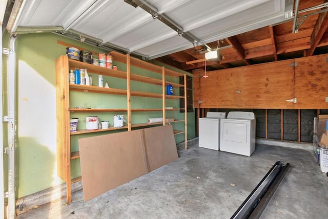 garage featuring separate washer and dryer and a garage door opener