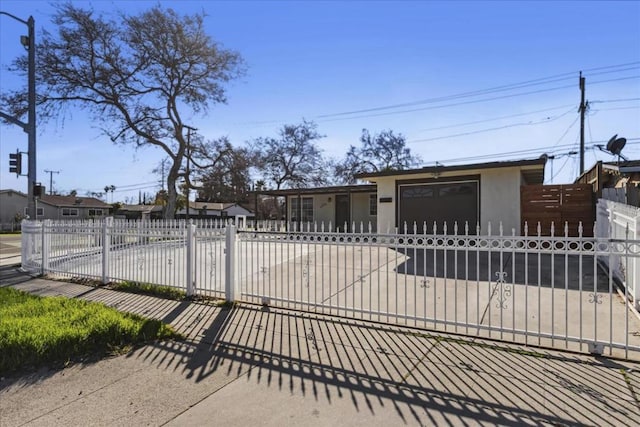 view of gate featuring a garage