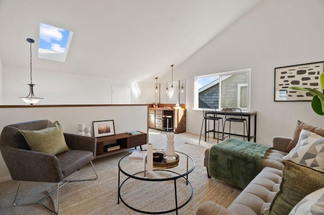 carpeted living room with a skylight and high vaulted ceiling