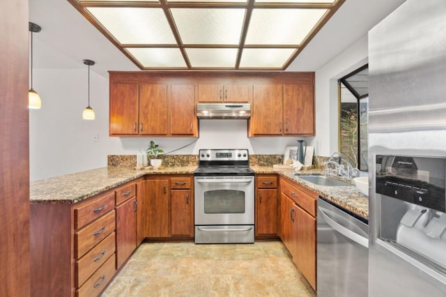 kitchen featuring sink, hanging light fixtures, stainless steel appliances, light stone countertops, and kitchen peninsula