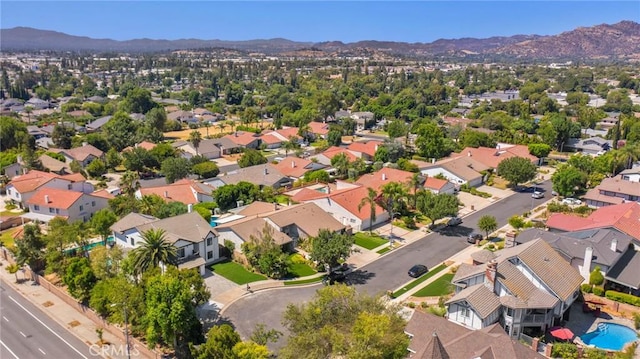 birds eye view of property with a mountain view