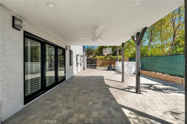 view of patio featuring ceiling fan