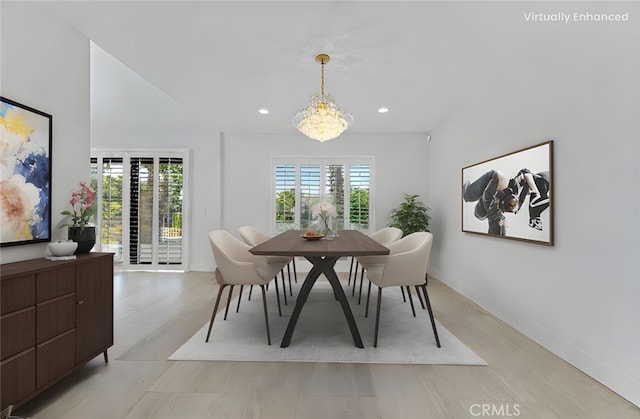 dining space with a chandelier