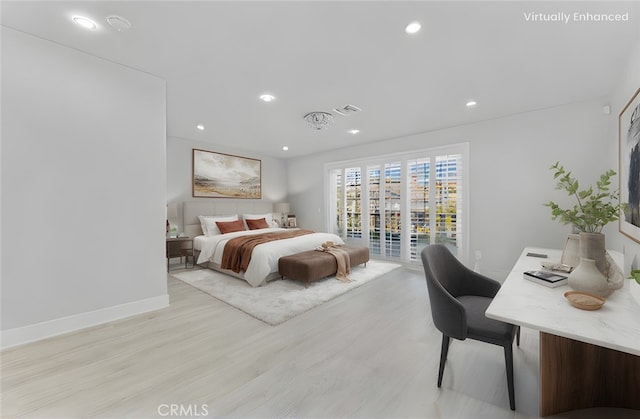 bedroom featuring access to exterior and light hardwood / wood-style floors