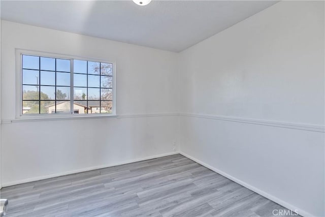 unfurnished room with light hardwood / wood-style flooring