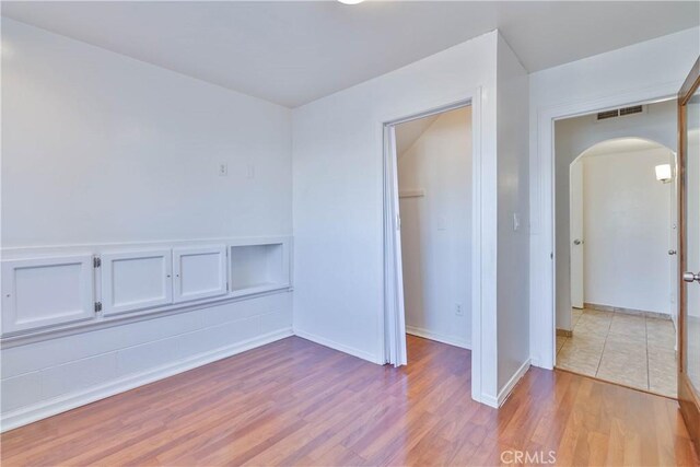 spare room featuring light hardwood / wood-style flooring