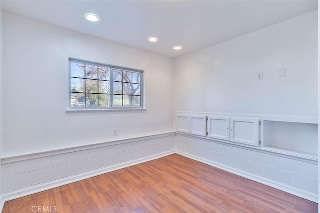 spare room featuring light hardwood / wood-style floors