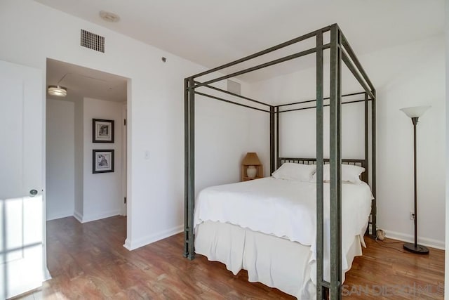 bedroom featuring wood-type flooring