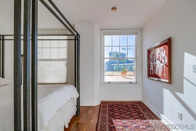 bedroom with hardwood / wood-style floors