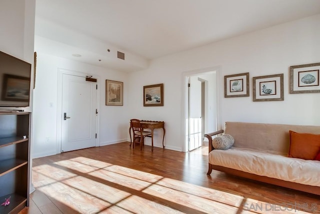 sitting room featuring wood-type flooring