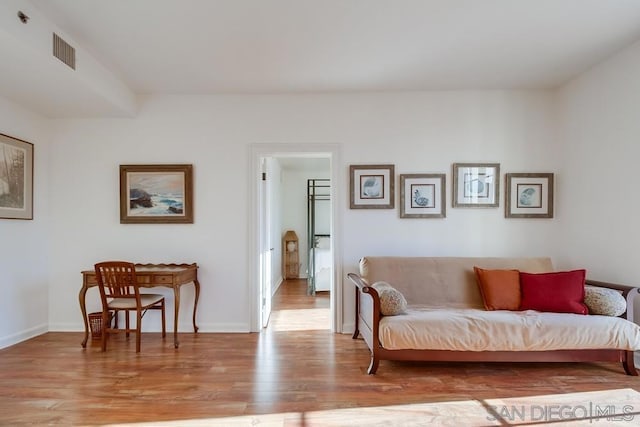 living area with light hardwood / wood-style floors