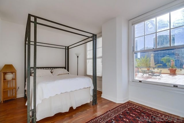 bedroom with wood-type flooring