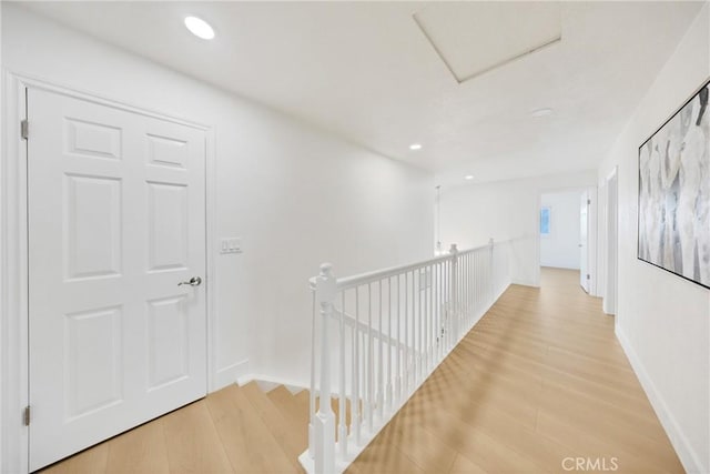 hall with hardwood / wood-style floors