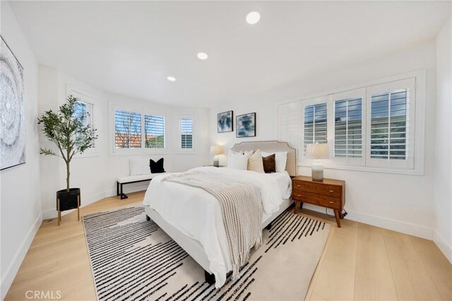 bedroom with light wood-type flooring