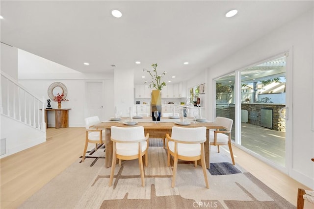 dining space with light wood-type flooring