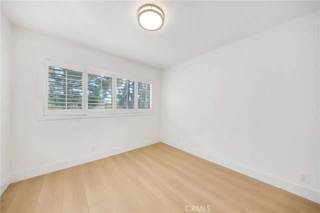 unfurnished room featuring wood-type flooring