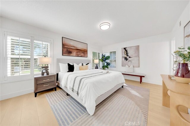 bedroom with light hardwood / wood-style floors