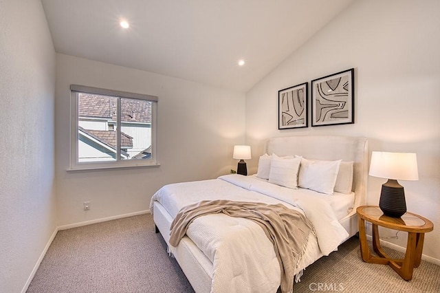 carpeted bedroom with vaulted ceiling