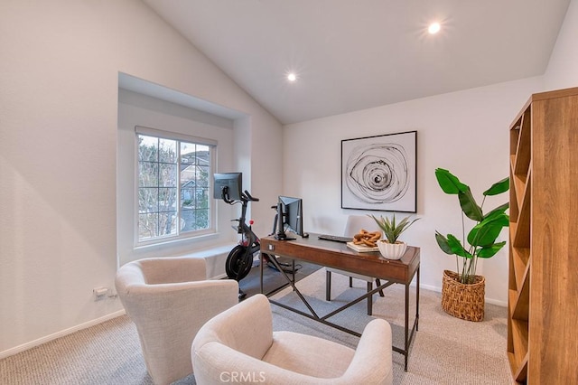 office area with carpet and vaulted ceiling