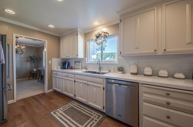 kitchen featuring white cabinets, an inviting chandelier, and stainless steel appliances