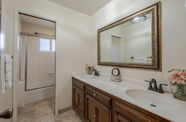 bathroom with enclosed tub / shower combo and vanity