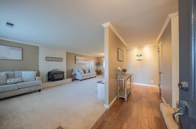 hall with crown molding and light hardwood / wood-style flooring