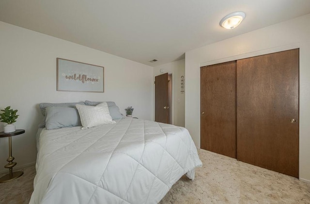 bedroom featuring a closet and carpet floors