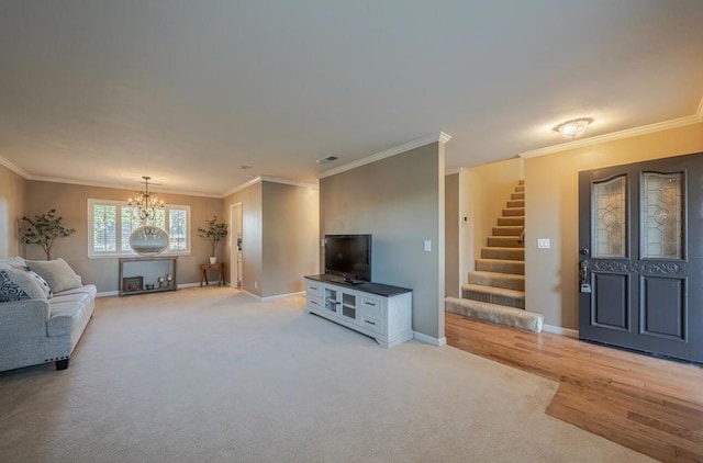 unfurnished living room with an inviting chandelier, crown molding, and light colored carpet