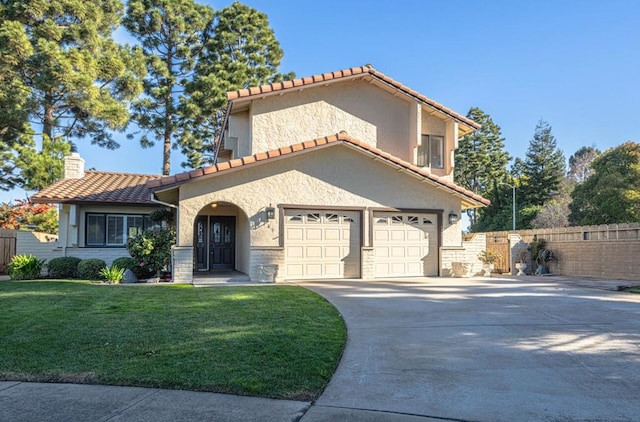 mediterranean / spanish-style house with a garage and a front lawn